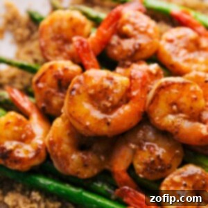 Zesty Lemon Garlic Shrimp 3 Delicious Lemon Garlic Shrimp served in a bowl, garnished with fresh parsley and lemon slices.