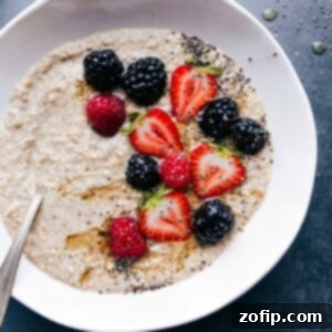 Effortless Overnight Steel Cut Oats 3 Finished breakfast dish topped with fresh berries, chia seeds, and honey, offering a warm and healthy start to the day.