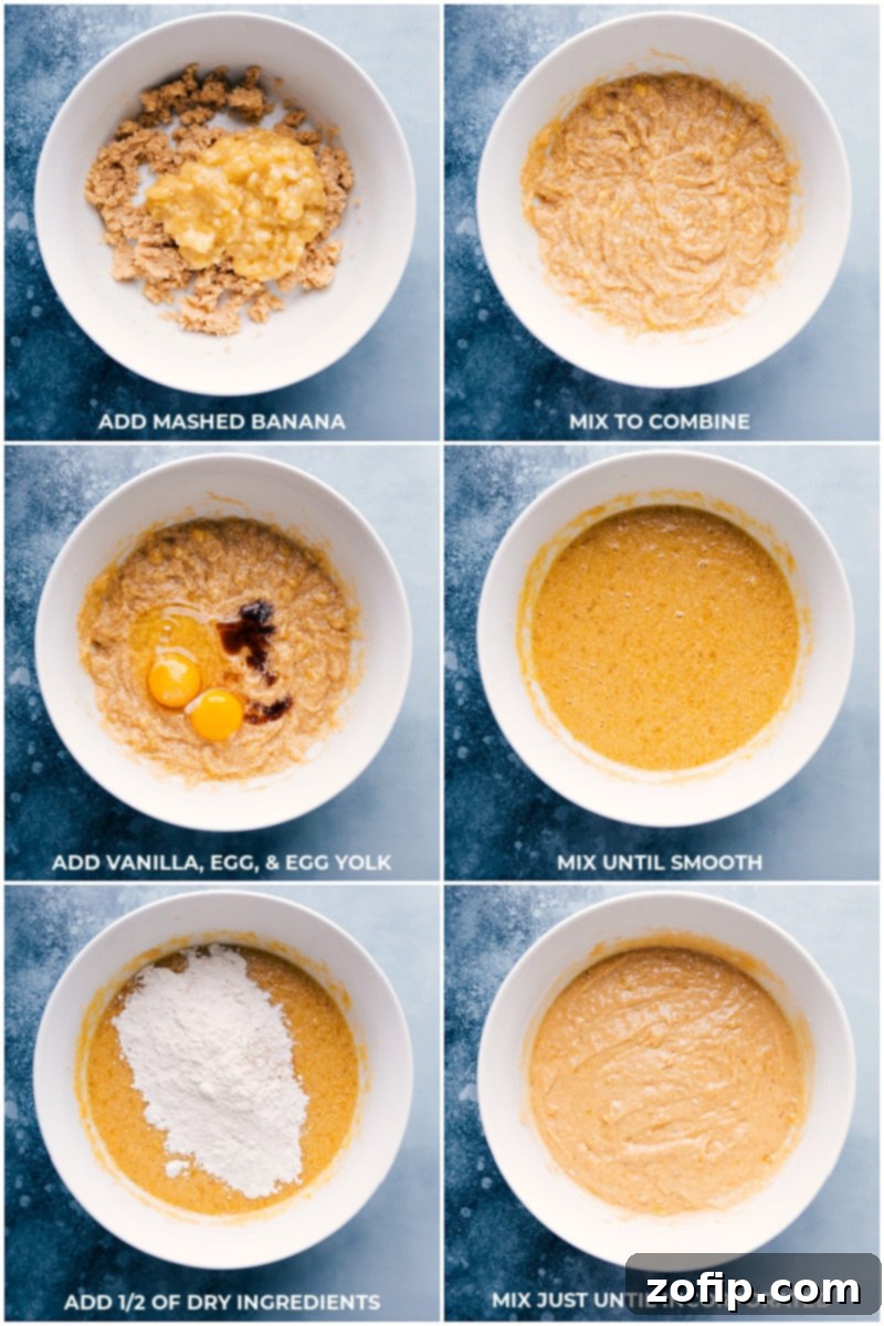 A close-up shot of mashed bananas being gently folded into the cupcake batter, illustrating the crucial step of incorporating the fruit for moist and flavorful banana cupcakes.