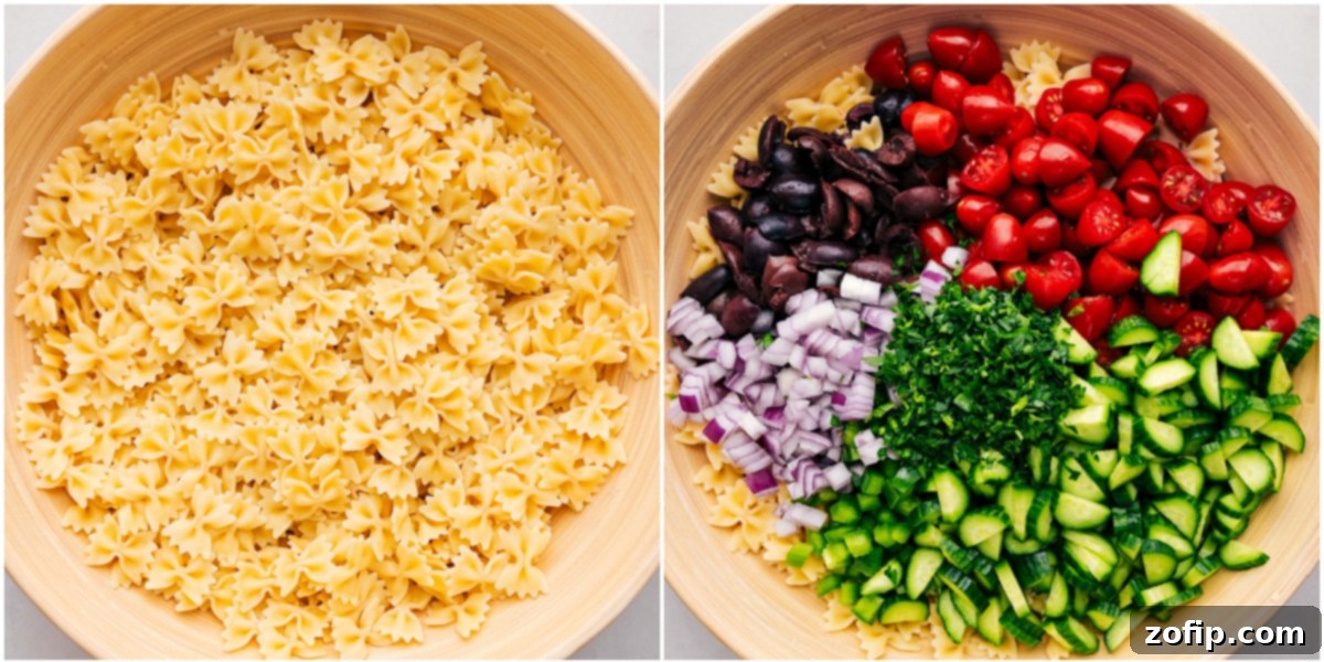 The cooked pasta and chopped vegetables being combined in a large mixing bowl for the Greek Pasta Salad.