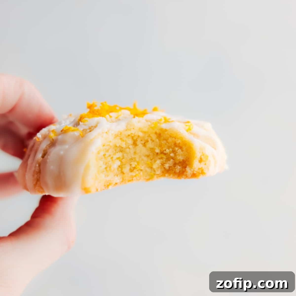 A beautifully arranged serving of lemon cookies on a rustic wooden surface.
