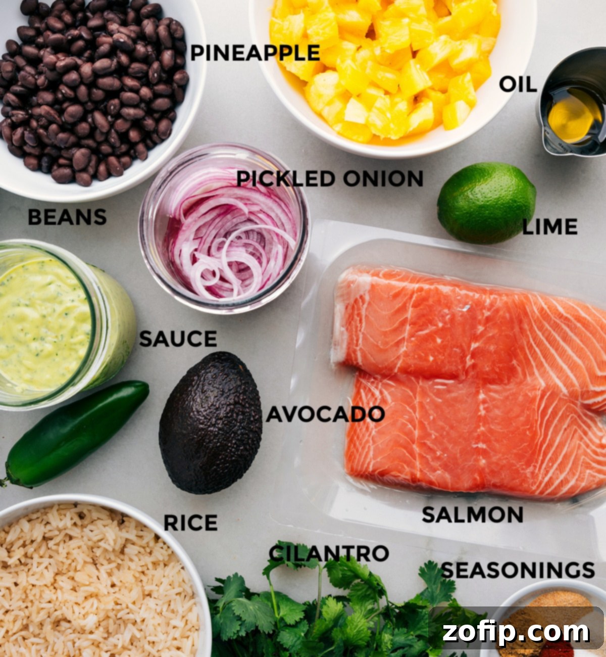 Ingredients In Mojo Salmon Bowls Prepped All the fresh ingredients required for this Mojo Salmon Bowls recipe, neatly prepped and organized for easy assembly.