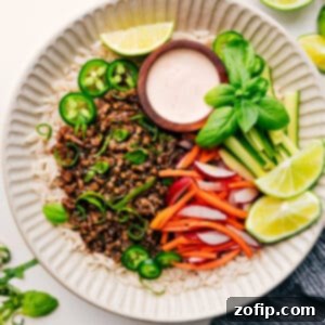 Banh Mi Power Bowl 3 Close-up of a Banh Mi Bowl with tender pork, pickled veggies, and creamy sauce.