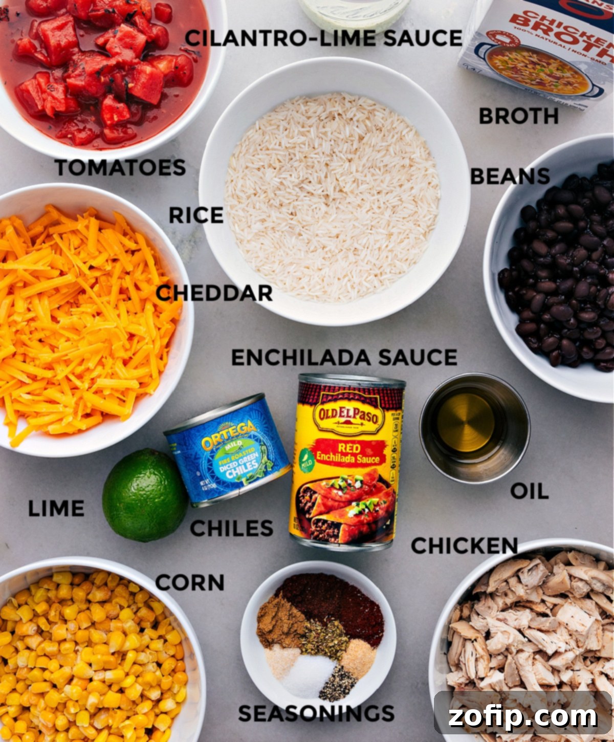 All fresh and colorful ingredients for the One-Pot Burrito Bowls are neatly prepped and laid out on a cutting board, ready for cooking.