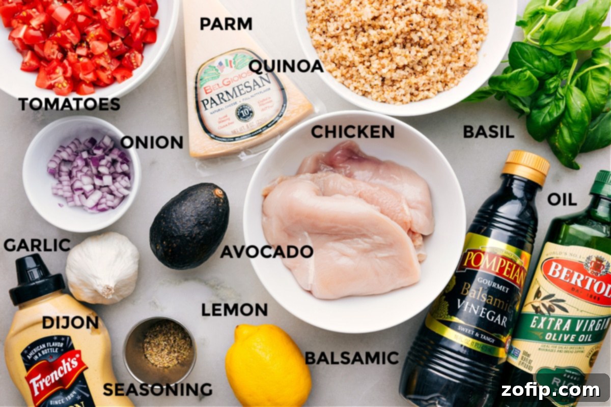 Ingredients In Bruschetta Chicken All the ingredients are prepped for easy assembly—tomatoes, Parmesan, quinoa, basil, chicken, avocado, onion, garlic, Dijon, lemon, balsamic, and seasonings.