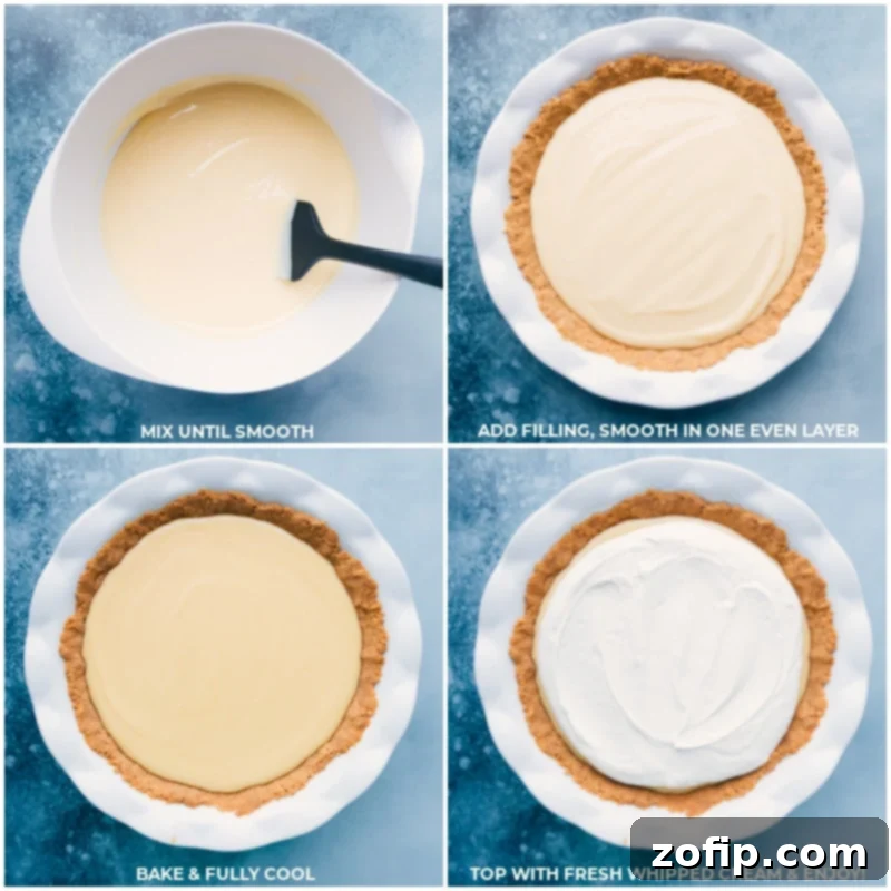 The creamy lemon pie filling being gently poured into the pre-baked graham cracker crust, followed by a thick layer of fresh whipped cream being spread on top.