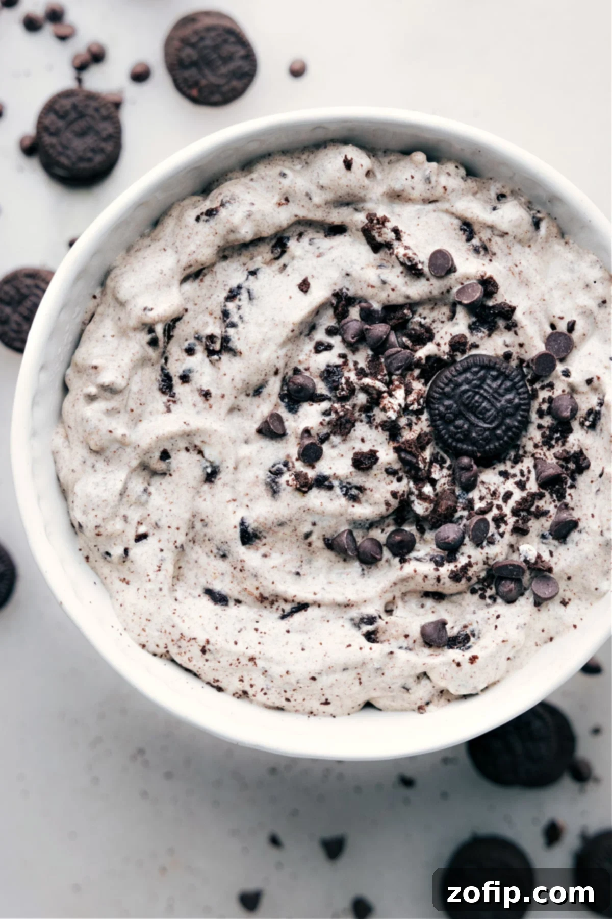 A beautifully presented bowl of Oreo Fluff, showcasing its creamy texture and visible Oreo cookie chunks.