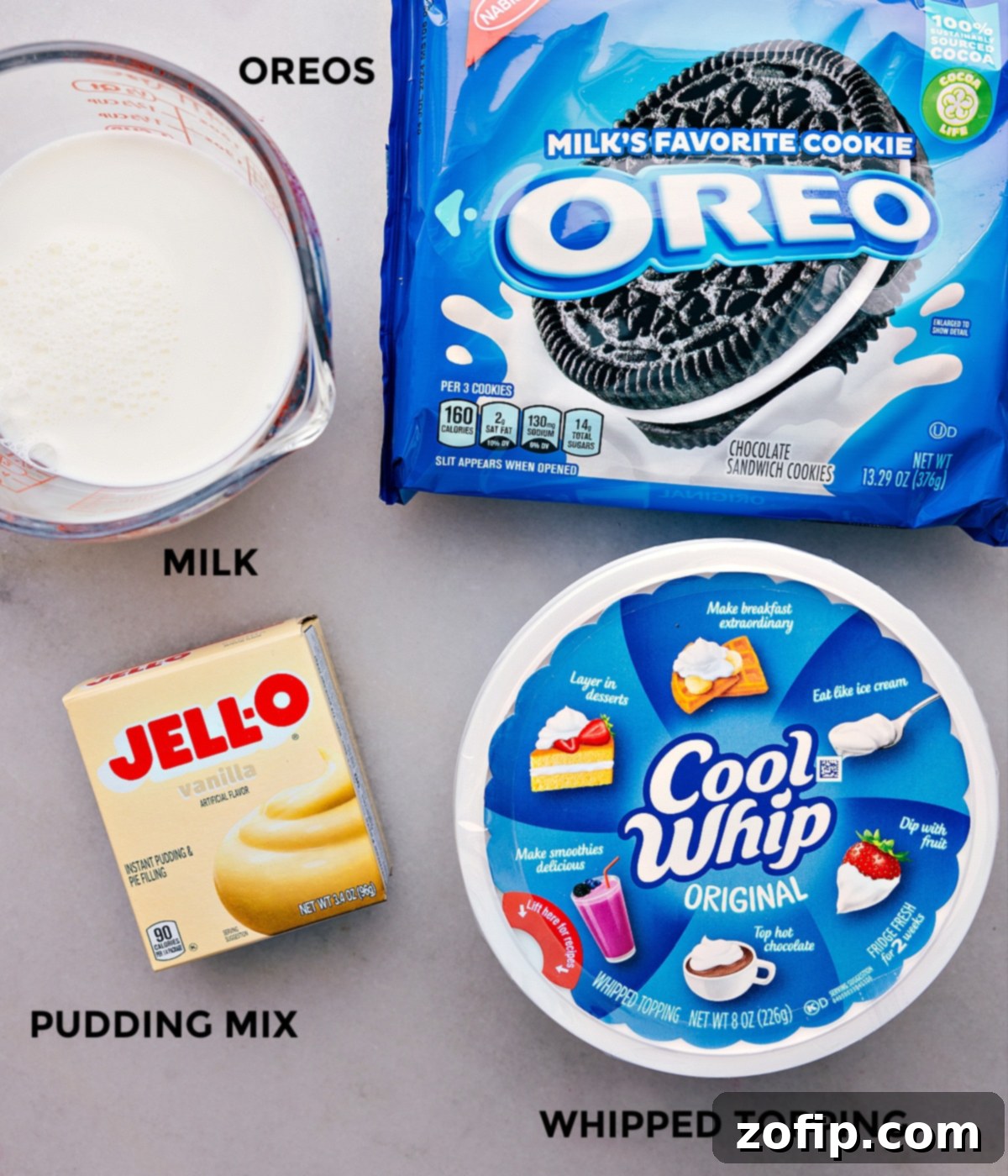 All the essential ingredients for making Oreo Fluff laid out on a table, prepped for easy assembly.