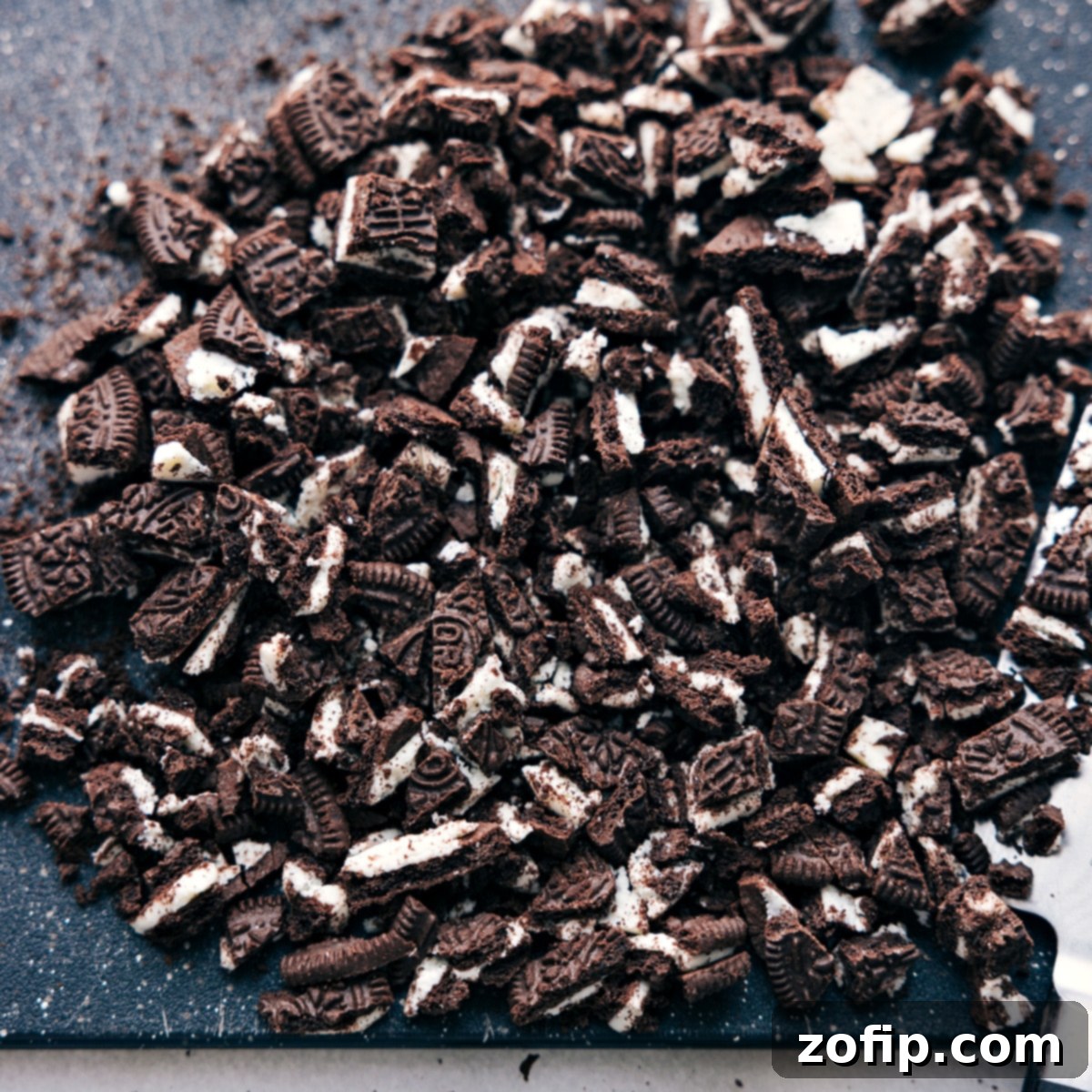 Oreo cookies expertly chopped into coarse pieces, ready to be incorporated into the fluff mixture.