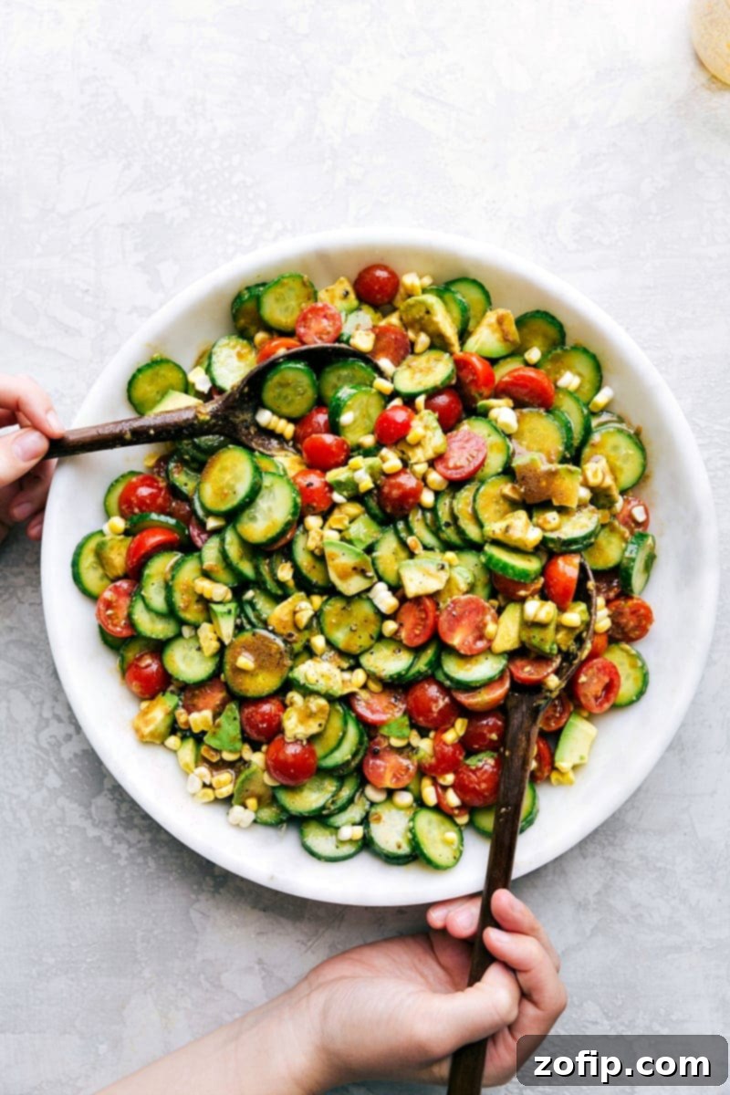 The best Cucumber Salad recipe! This beauty adds tomatoes, corn and avocado, with a balsamic vinaigrette. Recipe via ChelseasMessyApron.com #cucumbers #cucumbersalad #vegetarian #refreshing #corn #balsamic Fresh Cucumber Salad with Corn, Avocado, and Tomatoes, dressed in balsamic vinaigrette
