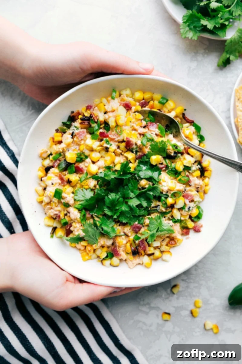 Creamy corn salad, rich and packed full of flavor, ready to be enjoyed as a delightful side dish. A perfect summer creamy corn salad with bacon and jalapeños.