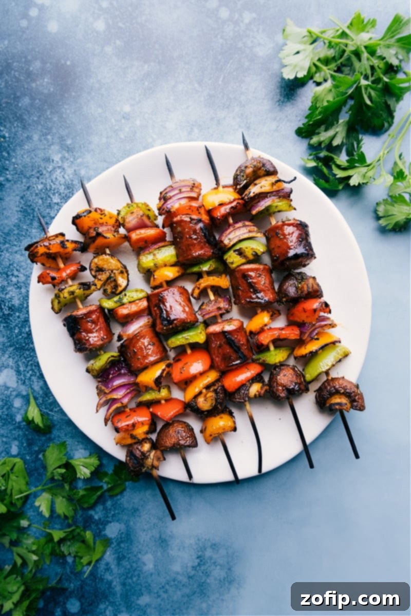 Overhead view of perfectly grilled Sausage Kabobs with colorful vegetables on a plate
