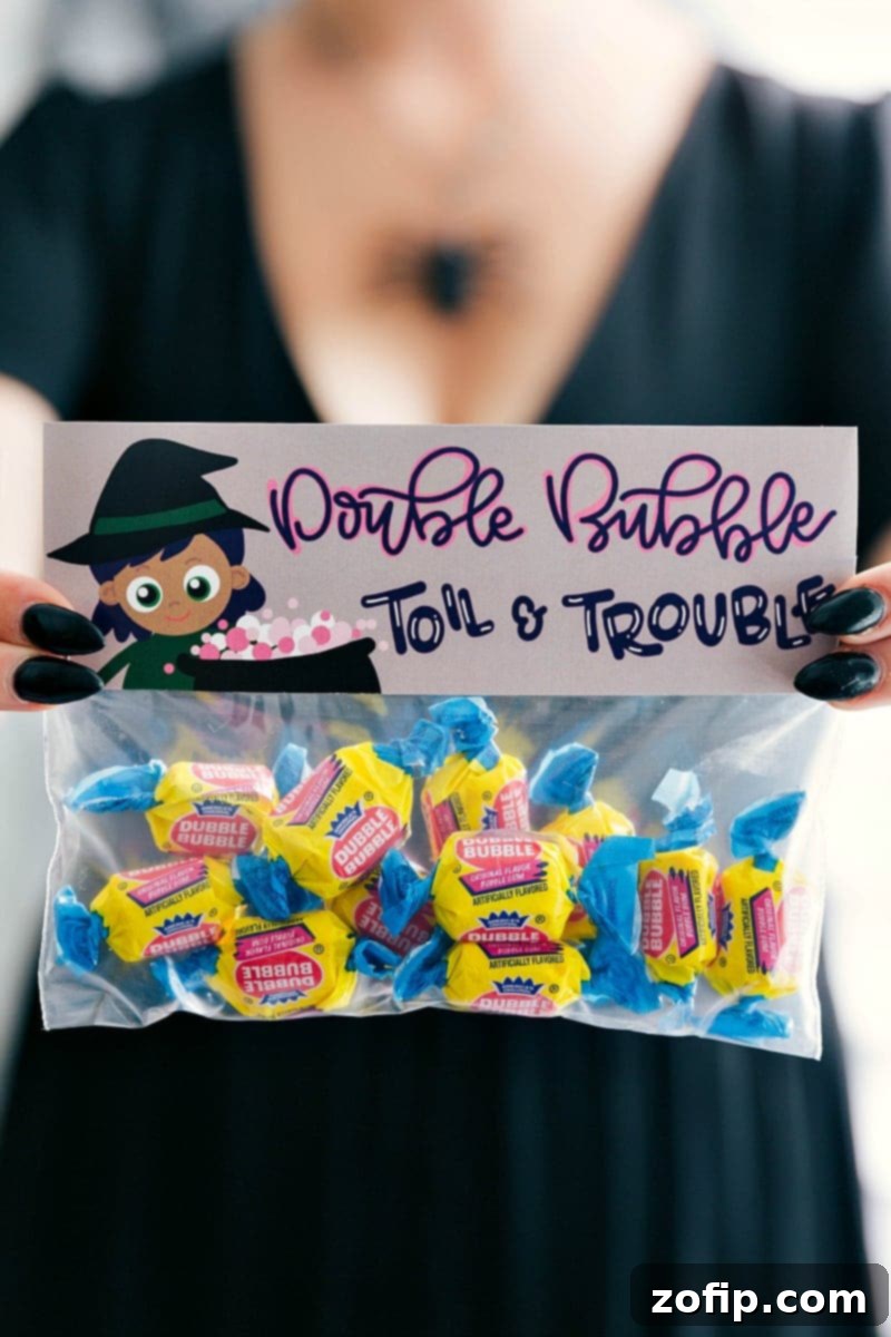 Free Printable Halloween Treat Bag Topper: Double Bubble Toil and Trouble design with colorful candies.