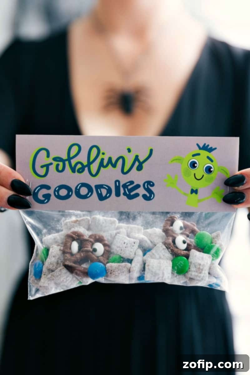 Close-up of a 'Twix Or Treat' Halloween bag featuring a charming witch hat design on the topper, filled with individually wrapped fun-sized Twix chocolate bars.