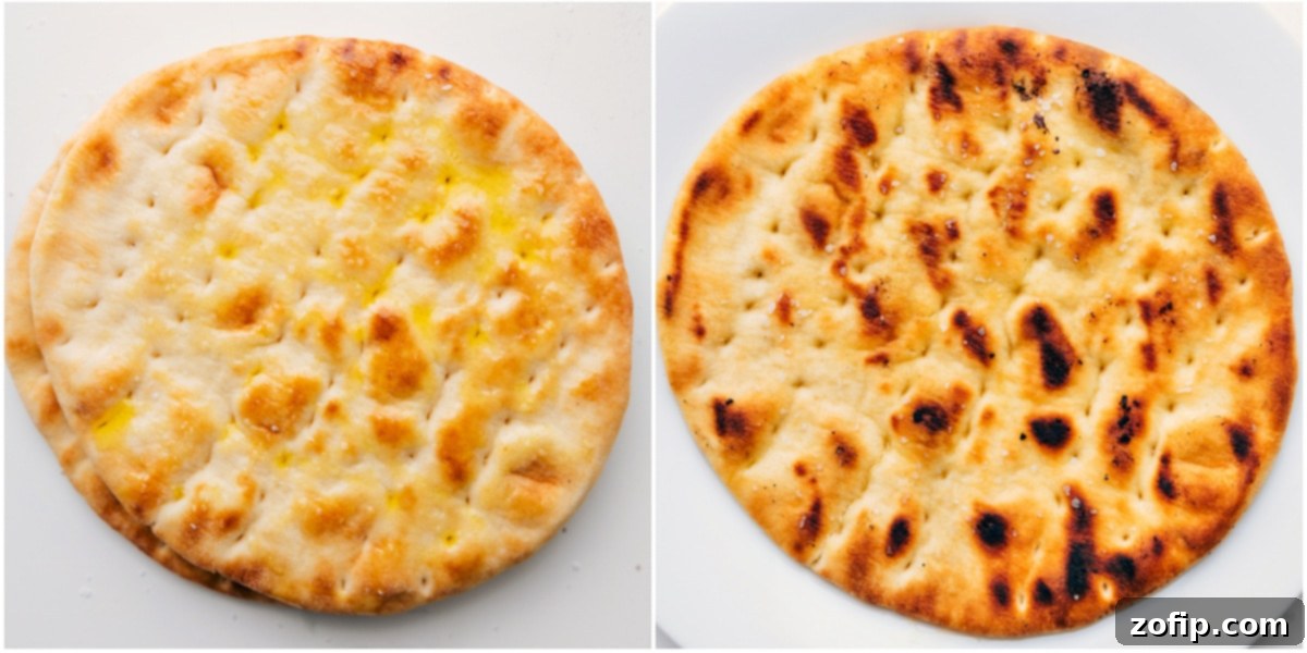 This Grilled Steak Salad is inspired by a restaurant favorite! We toss together perfectly grilled steak, lightly salted & grilled pita bread, baby spinach, crisp cucumbers, sweet cherry tomatoes, Kalamata olives, and salty feta cheese. We drizzle a show-stopping sweet lemon-honey vinaigrette on this salad as the perfect finishing touch! Recipe via chelseasmessyapron #healthy #clean #cleaneating #best #protein #pita #grilled #steak #salad Pita bread brushed with olive oil and seasoned, then grilled to a golden perfection, ready to be cut into crispy croutons for the Grilled Steak Salad.