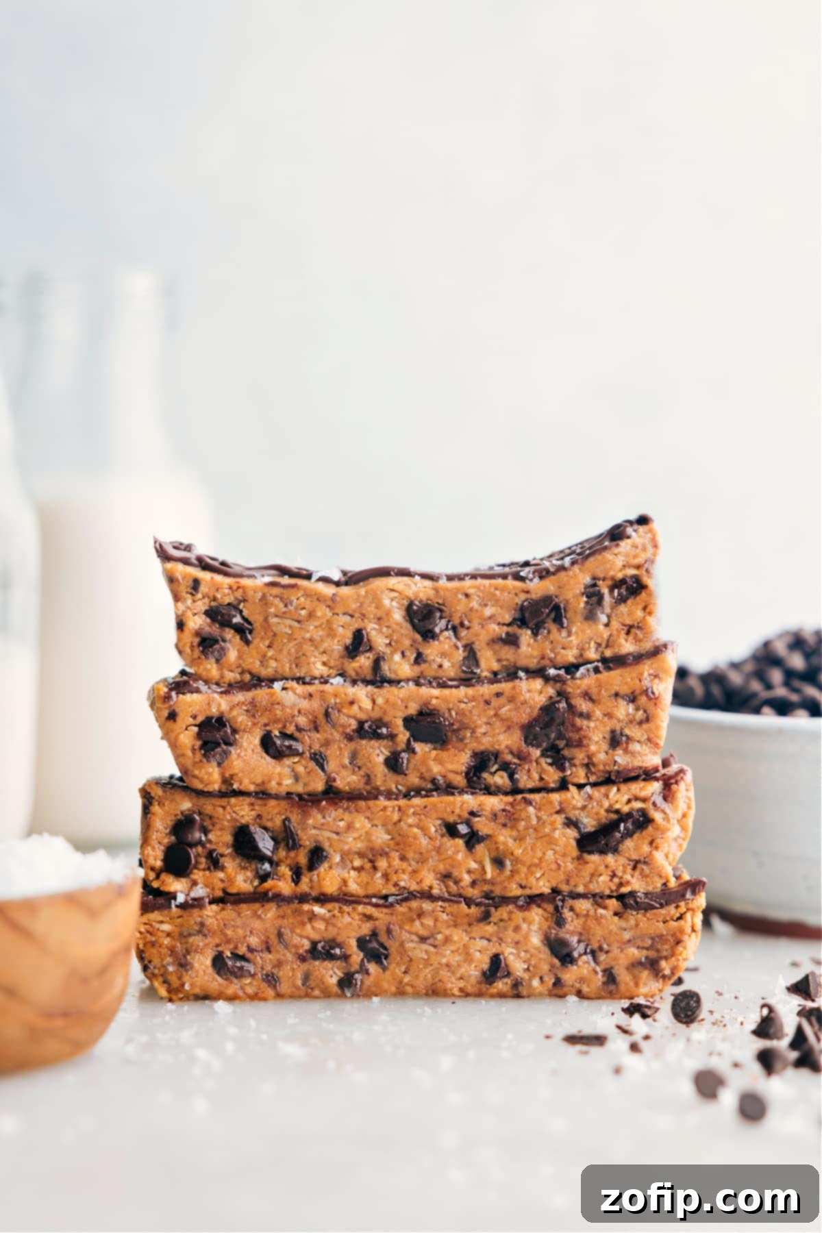 Homemade Protein Bars stacked on top of each other, showcasing their delicious texture and chocolate drizzle.