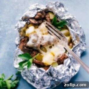 Final plated Philly Cheesesteak Foil Pack with melted cheese