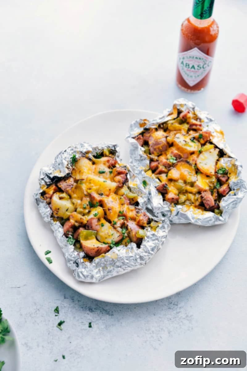 Sausage and Potato Foil Packs fresh off the grill ready to be enjoyed.
