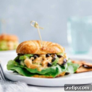 A top-down view of a Honey Mustard Chicken Salad Sandwich, highlighting its vibrant colors and textures.