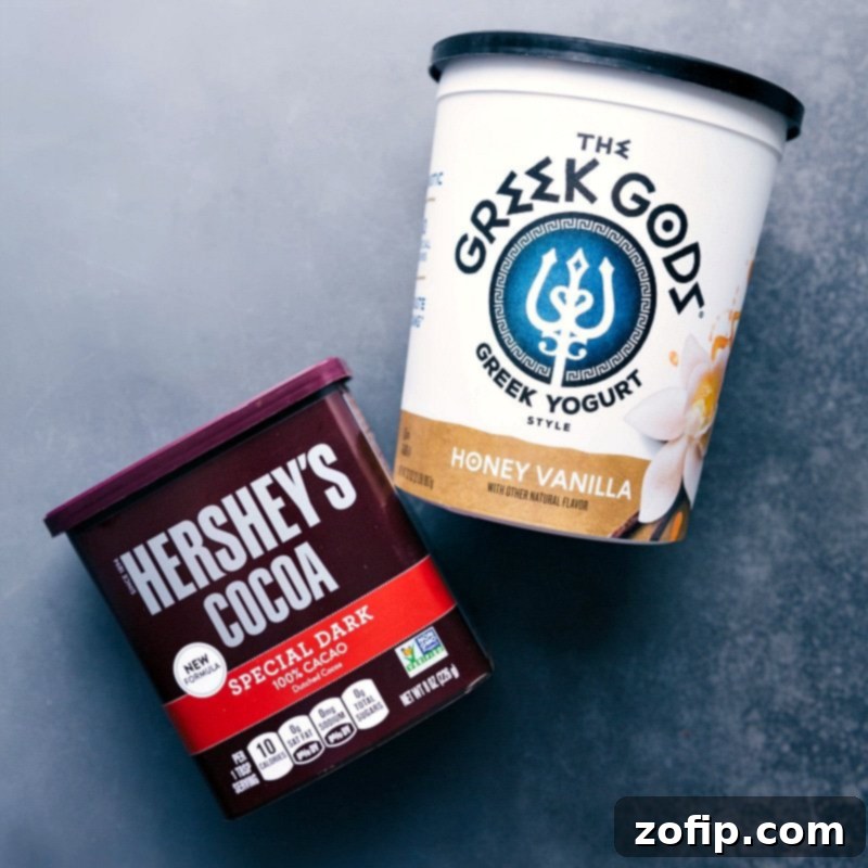 The recommended honey vanilla Greek yogurt and Dutch-processed cocoa powder, vital components for this rich brownie batter overnight oats recipe.