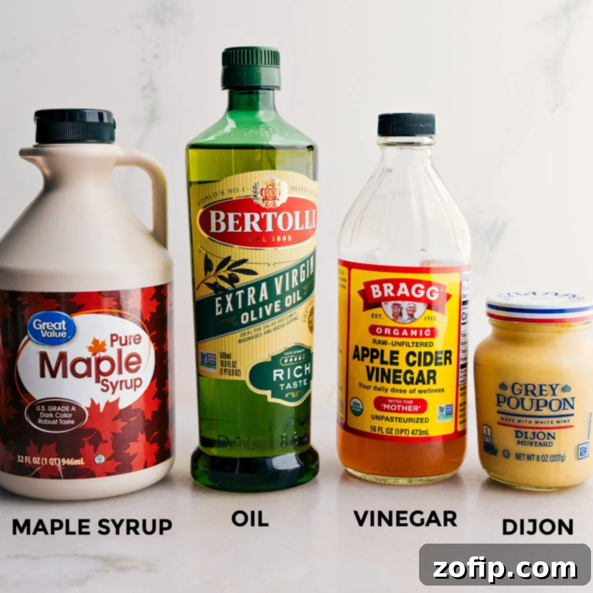 Ingredients for the Spinach Salad dressing: apple cider vinegar, olive oil, maple syrup, and Dijon mustard.