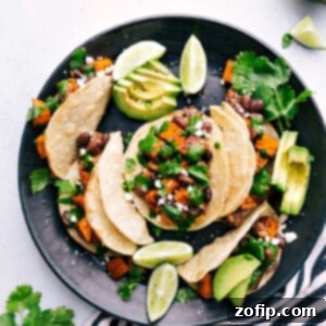 Top Vegetarian Tacos 2 Close-up of a perfectly filled vegetarian taco with roasted sweet potatoes, black beans, and a creamy sauce