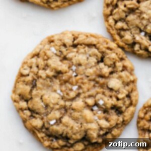 Chewy Oatmeal Delights 3 Perfectly baked Oatmeal Cookies cooling on a wire rack, ready to be enjoyed