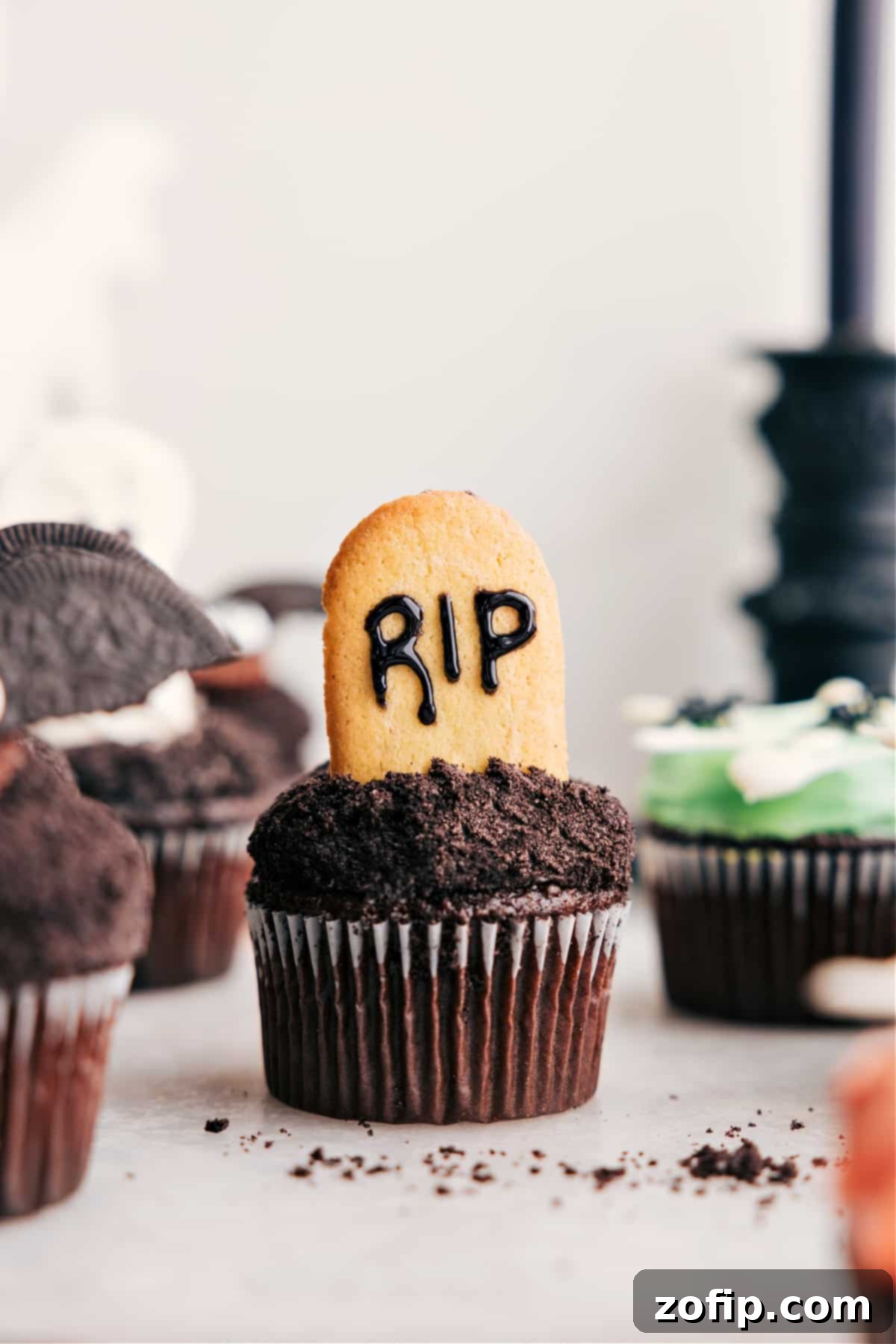 Tombstone Themed Halloween Cupcakes Tombstone treat with Milano cookies and black frosting.