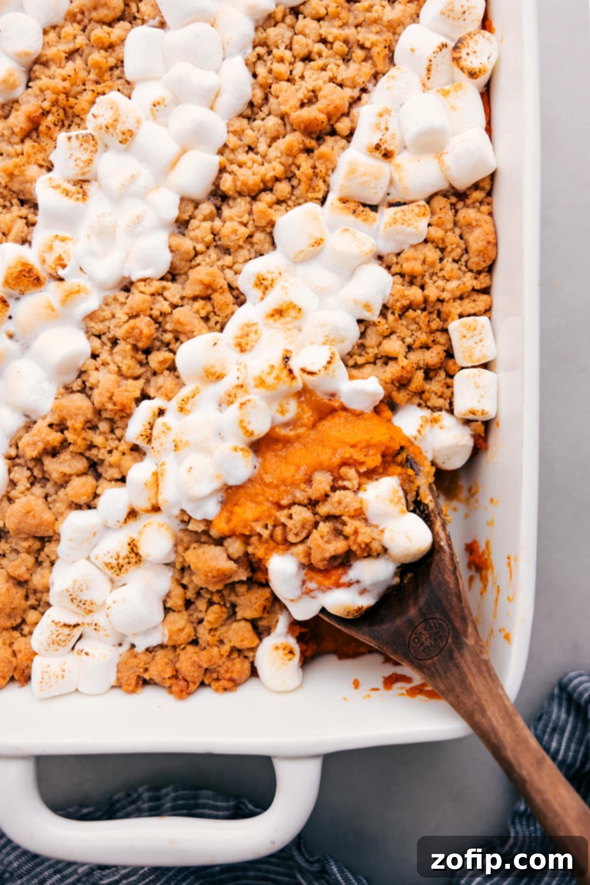 The Ultimate Thanksgiving Side: Sweet Potato Casserole Sweet Potato Casserole fresh out of the oven with two toppings: crunchy streusel on one side and golden marshmallows on the other.