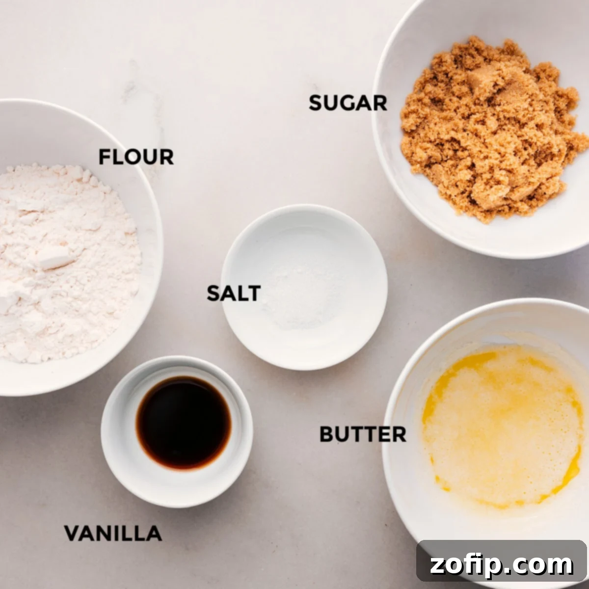 How To Make The Streusel Topping The individual ingredients for the streusel topping of this sweet potato casserole recipe, including flour, salt, vanilla extract, brown sugar, and melted butter, arranged neatly.