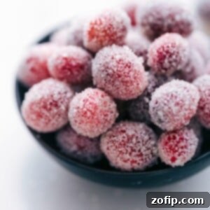 Sparkling Sugared Cranberries 3 A festive image of a bowl of sparkly sugared cranberries, ready to garnish holiday dishes.