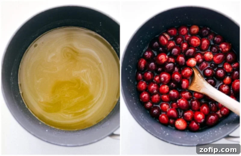 Infusing Cranberries with Sweet Orange Flavor Fresh cranberries being gently stirred into a warm orange juice and sugar syrup in a saucepan, highlighting the infusion process.