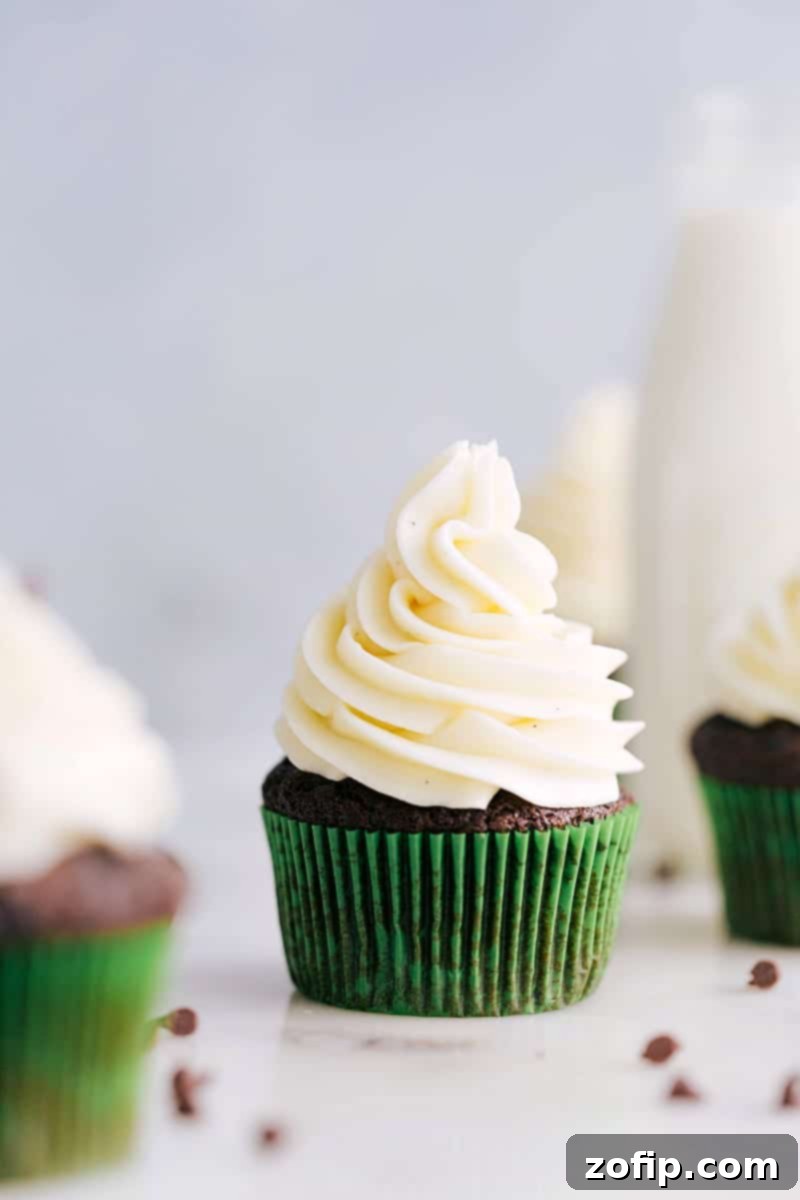 A cupcake generously topped with delicious homemade Cream Cheese Frosting.