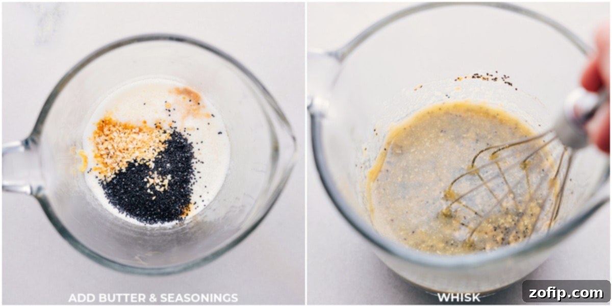 The savory butter and seasoning mixture being meticulously whisked together in a clear glass measuring cup, ready to be brushed onto the sliders. Visible ingredients include melted butter, Dijon mustard, poppy seeds, dried minced onion, garlic powder, Worcestershire sauce, salt, and pepper, forming a flavorful golden liquid.