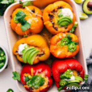 Fiesta Stuffed Peppers 3 Close-up of a perfectly baked Mexican Stuffed Pepper, showing the golden cheese topping and hearty filling.