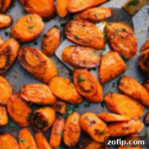Roasted Carrots Two Delicious Takes 3 Pan of roasted and seasoned carrots with a golden, caramelized finish.