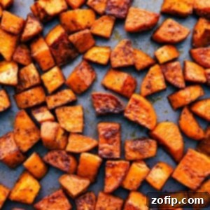 A close-up of beautifully roasted sweet potatoes in a bowl