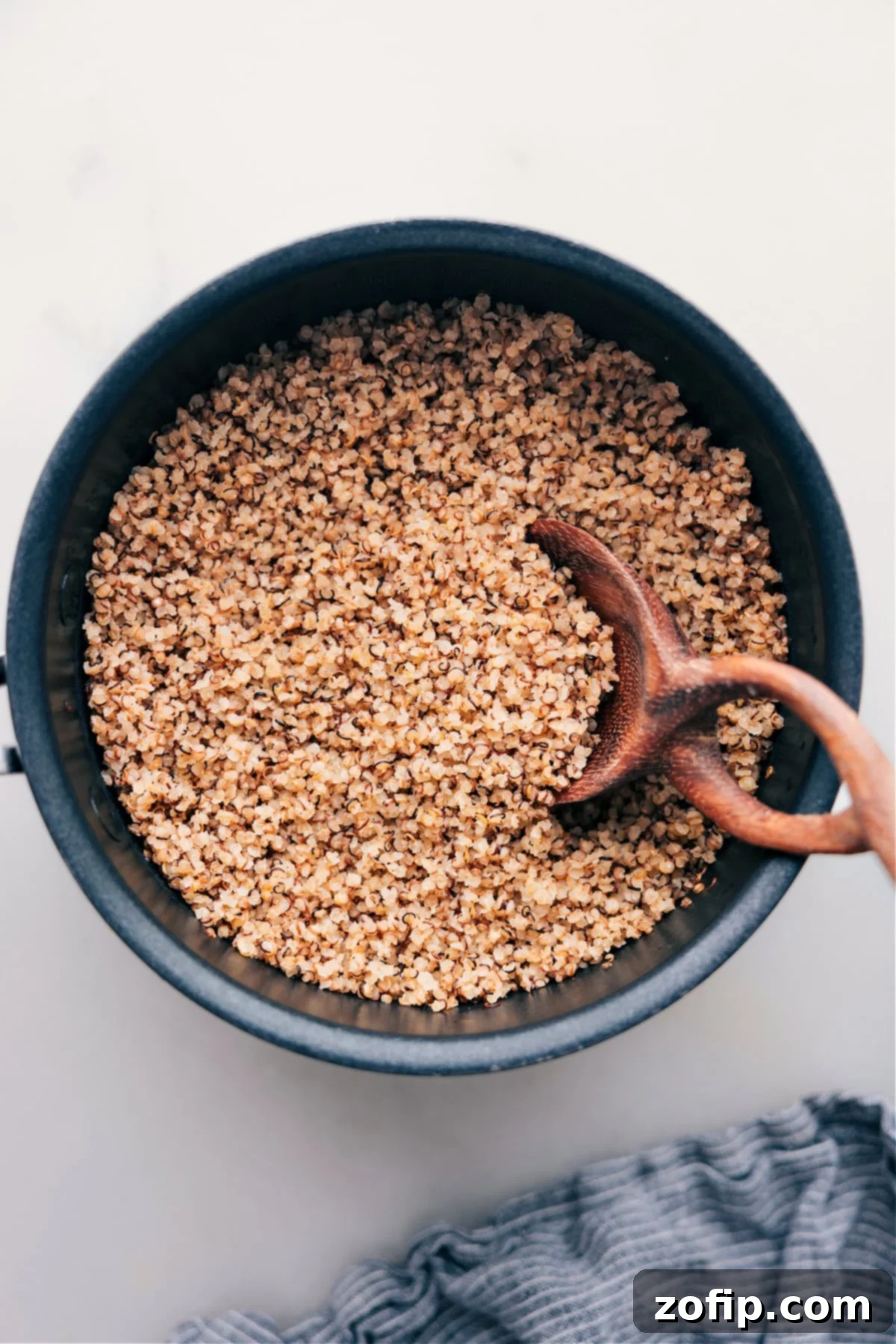 Perfectly cooked quinoa in a pot, ready to be served and enjoyed, showcasing its fluffy texture.