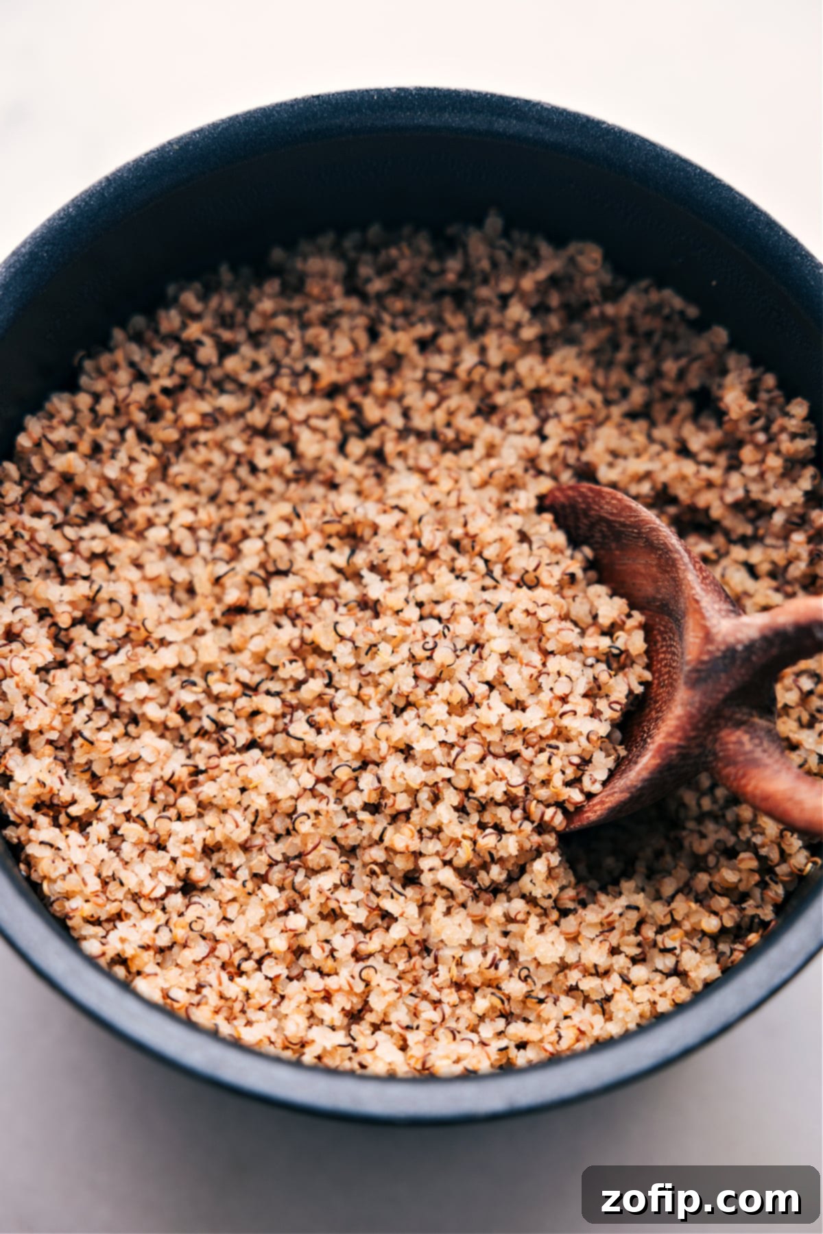 Freshly cooked quinoa in a serving bowl, perfectly fluffed and ready to be enjoyed as a healthy and versatile meal component.