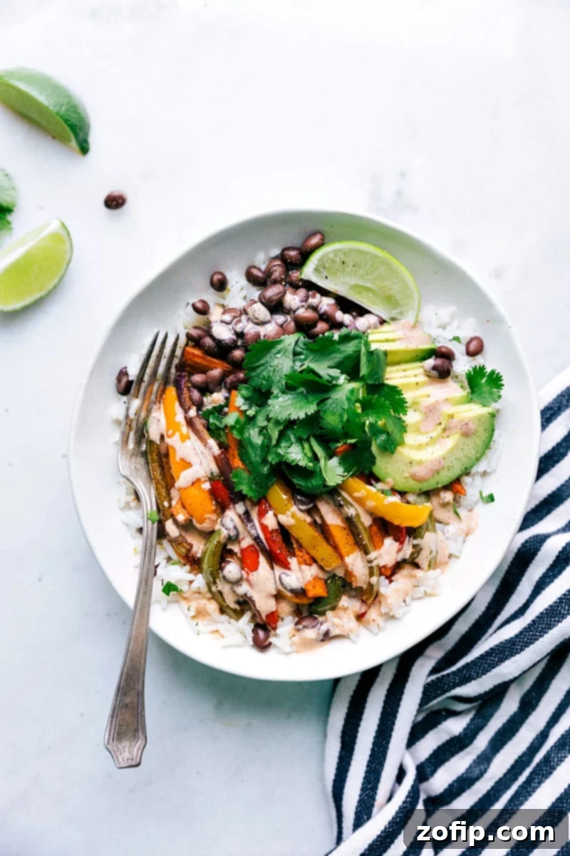 Vibrant Vegetarian Fajitas served in a bowl, showcasing perfectly seasoned sweet potatoes, bell peppers, and onion.