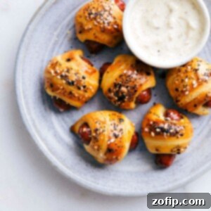 Close-up of baked pigs in a blanket with everything bagel seasoning