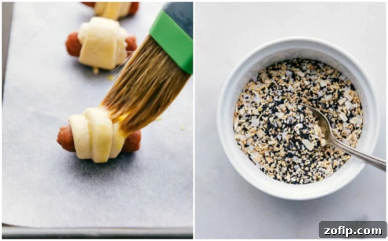 Egg wash is brushed onto the wrapped sausages, followed by a sprinkle of seasoning mix.