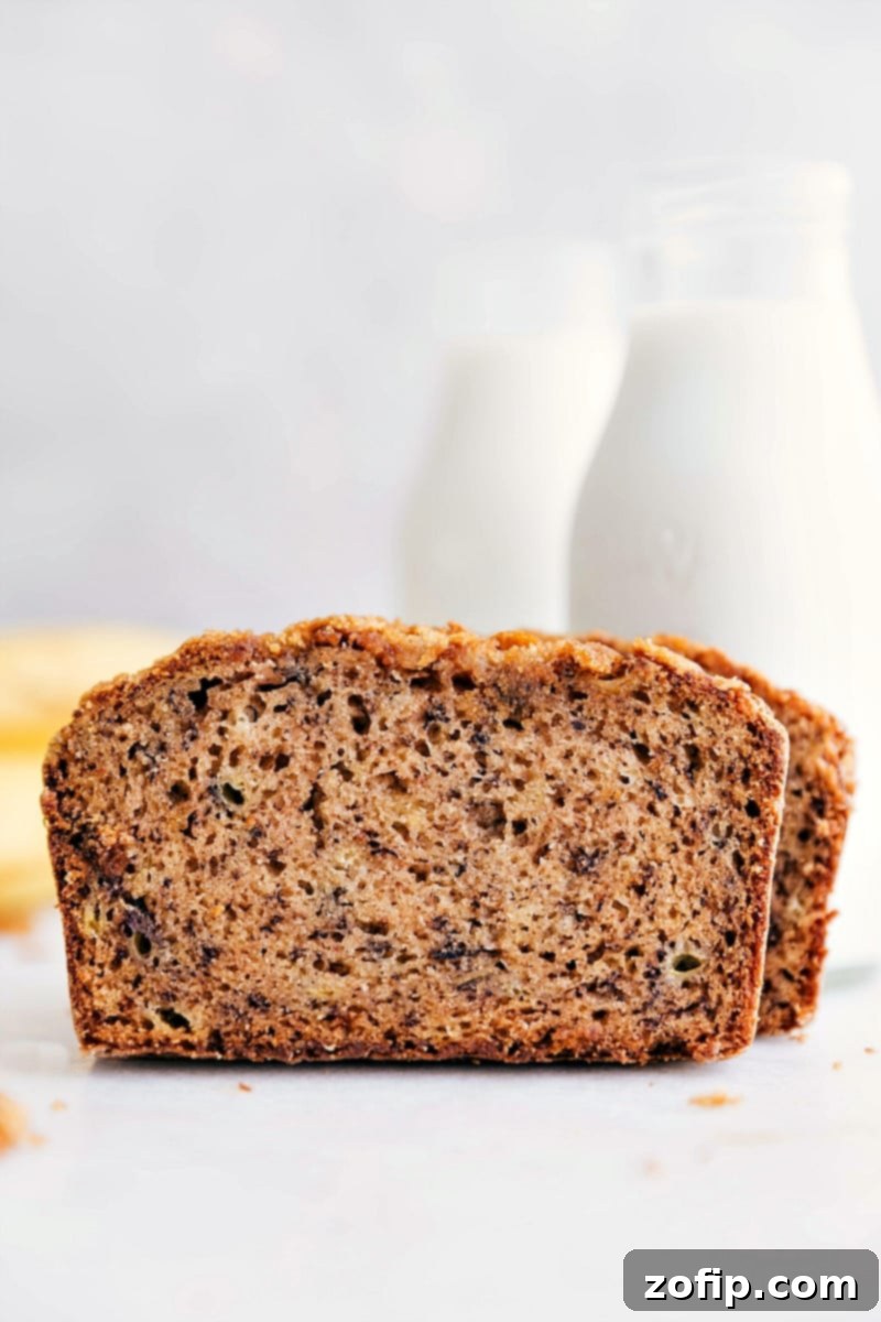 Moist and flavorful Easy Banana Bread slices, a perfect family favorite for ripe bananas Slices of moist and flavorful Easy Banana Bread on a wooden board