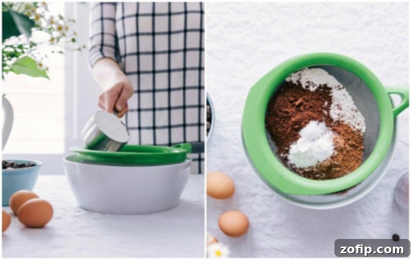 A close-up shot of dry ingredients, including flour, cocoa powder, and leavening agents, being sifted into a large mixing bowl for chocolate muffins.