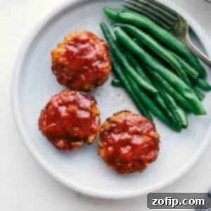 Ready-to-eat mini turkey meatloaves next to green beans.