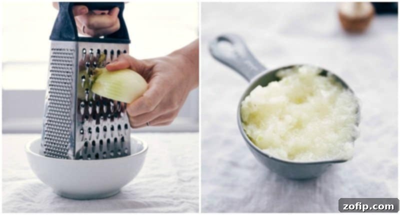 A close-up shot of an onion being grated, a crucial step in preparing the savory turkey meatloaf mixture.