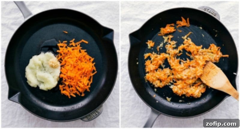 An overhead shot of diced onion, minced garlic, and shredded carrots being sautéed in a pan, filling the kitchen with inviting aromas.