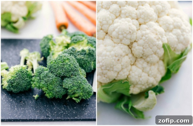 Freshly cut broccoli and cauliflower florets, washed and ready for roasting, key components for creating flavorful pesto vegetable bowls. Image of fresh broccoli and cauliflower florets prepped and ready for roasting in these Pesto Veggie Bowls.