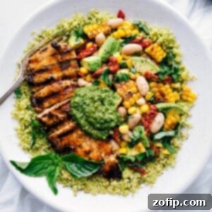 Pesto Chicken with chicken, corn and white bean salsa, and pesto on top.