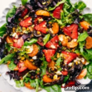 Beautifully plated Strawberry Salad with citrus dressing.